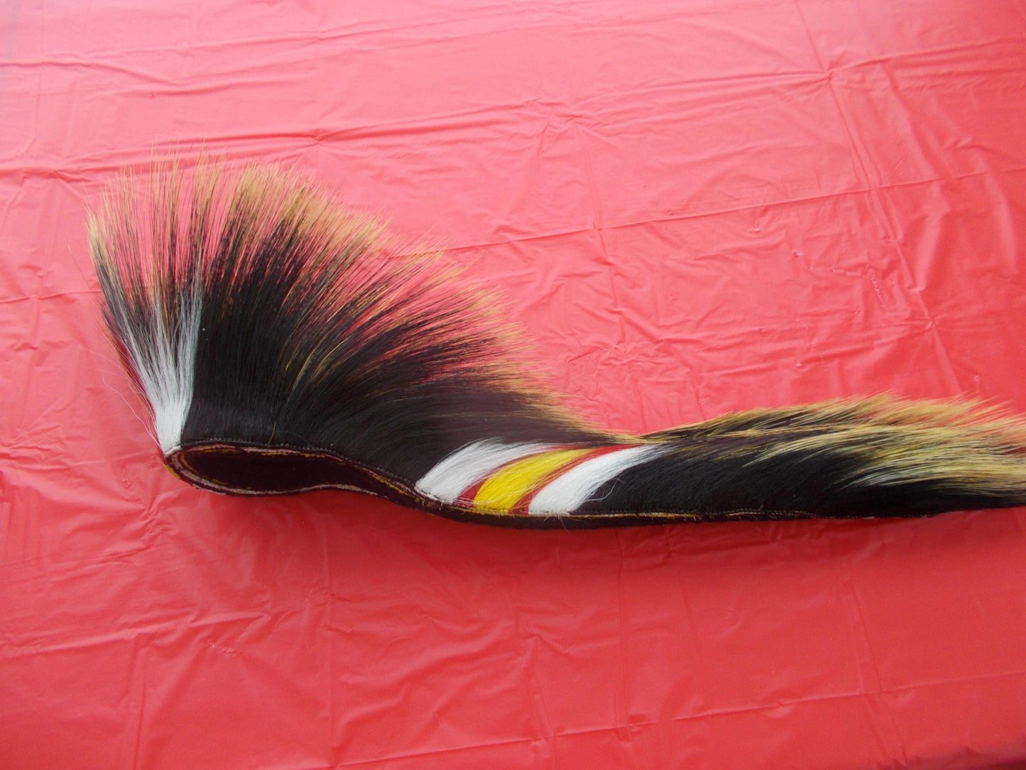 17 1/2 in Porcupine guard hair roach with black yarn base with multi color deer hair out side and out 8 1/2" porcupine hair in front
