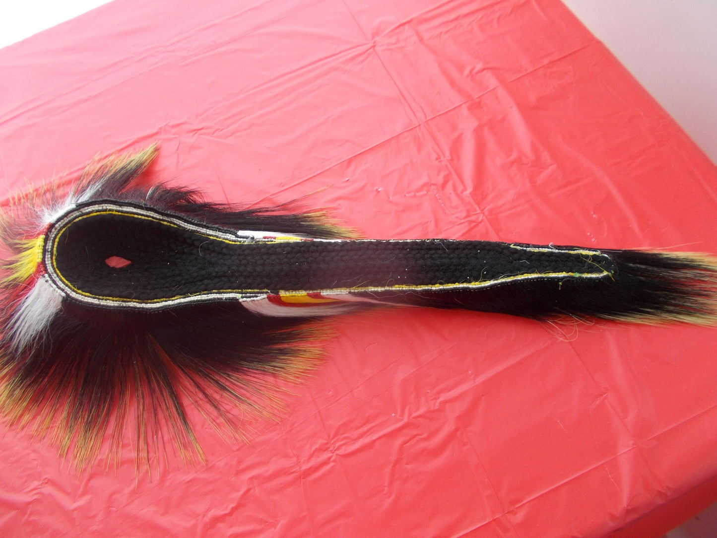 17 1/2 in Porcupine guard hair roach with black yarn base with multi color deer hair out side and out 8 1/2" porcupine hair in front