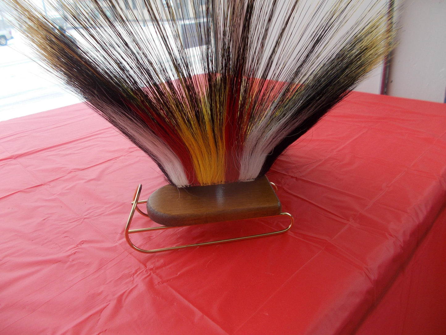 17 1/2 in Porcupine guard hair roach with black yarn base with multi color deer hair out side and out 8 1/2" porcupine hair in front